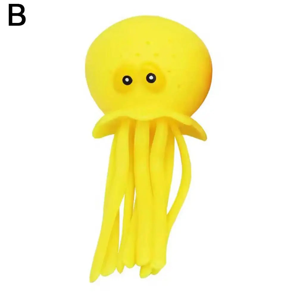 A bright yellow squeeze and soak octopus bath toy for toddlers.