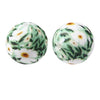Pair of white silicone beads printed with green leaves and yellow flowers for jewelry making