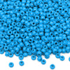 A pile of small, bright blue pony beads for jewelry making