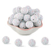 A pile of small, round, iridescent silver and pink rhinestone acrylic beads for jewelry making.