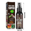 A black glass bottle of Stinky Ass spray with a silver pump and a brown cardboard box labeled Toxic Bomb Super