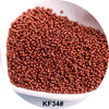 A pile of reddish-brown seed beads is shown in a white bowl.