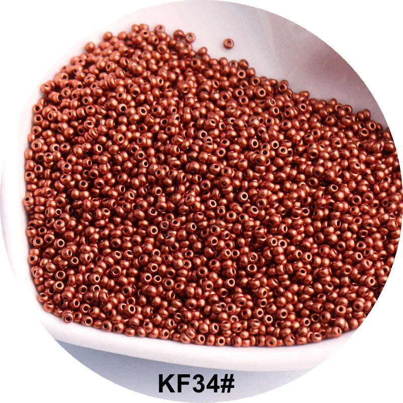 A pile of reddish-brown seed beads is shown in a white bowl.