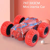 A red mini inertia car toy with four rubber wheels is shown on a pink background.