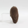 A brown, fuzzy plush charm shaped like a hand with a silver chain detail.