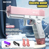Pink electric water cannon toy gun with a drum magazine and accessories