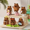 A set of cute brown bear micro building blocks featuring a capybara theme, displayed on a wooden shelf.