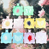 A collection of diamond painting organizer trays in various pastel colors, featuring floral and butterfly designs.