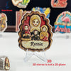 A 3D refrigerator magnet featuring a portrait of a woman in traditional Russian attire with the word Russia.