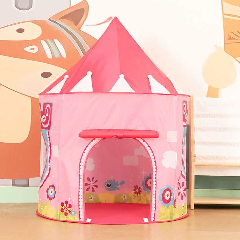 A pink pop-up play tent shaped like a rocket ship with an arched entrance and decorative floral patterns.