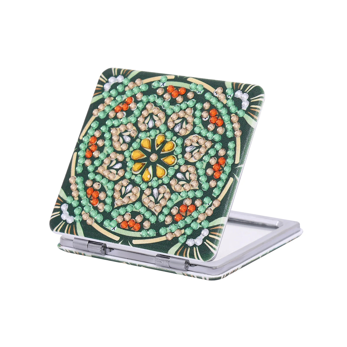 A folding mirror with a leather cover decorated in a diamond art pattern featuring green, orange, and yellow stones.