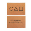 A brown card featuring three geometric shapes: a circle, a triangle, and a square, with Korean text below.