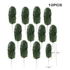 Twelve artificial tropical palm leaves in various shades of green displayed against a white background.