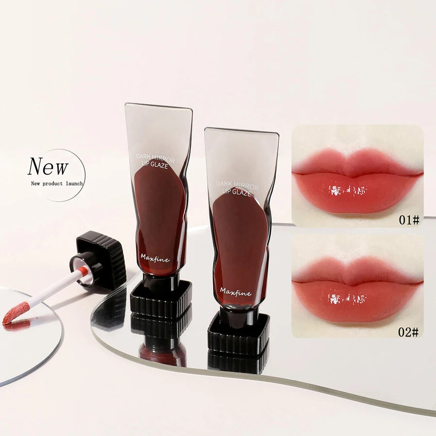 A set of Maxfine hydrating mirror lip glaze tubes in various shades displayed next to a cosmetic product launch label.