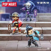 A collectible PVC figurine of a character in Overwatch, displayed on stone steps.