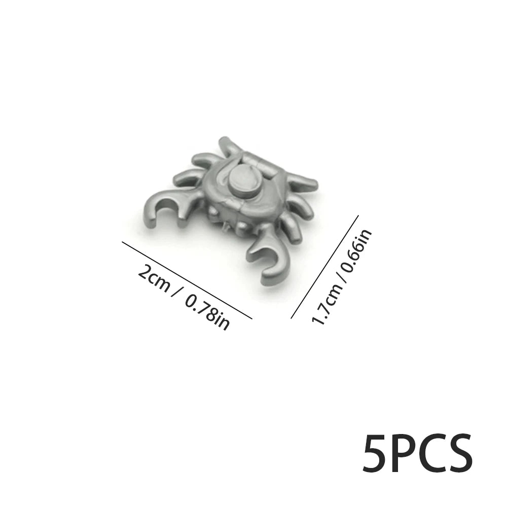 Five gray marine creature building blocks with a central eye design.