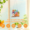 DIY acrylic double-sided bird ornament featuring colorful feathered designs hanging in front of a slatted window.
