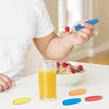 A hand is holding a blue foam grip sleeve, demonstrating comfortable foam grips for tools and utensils.