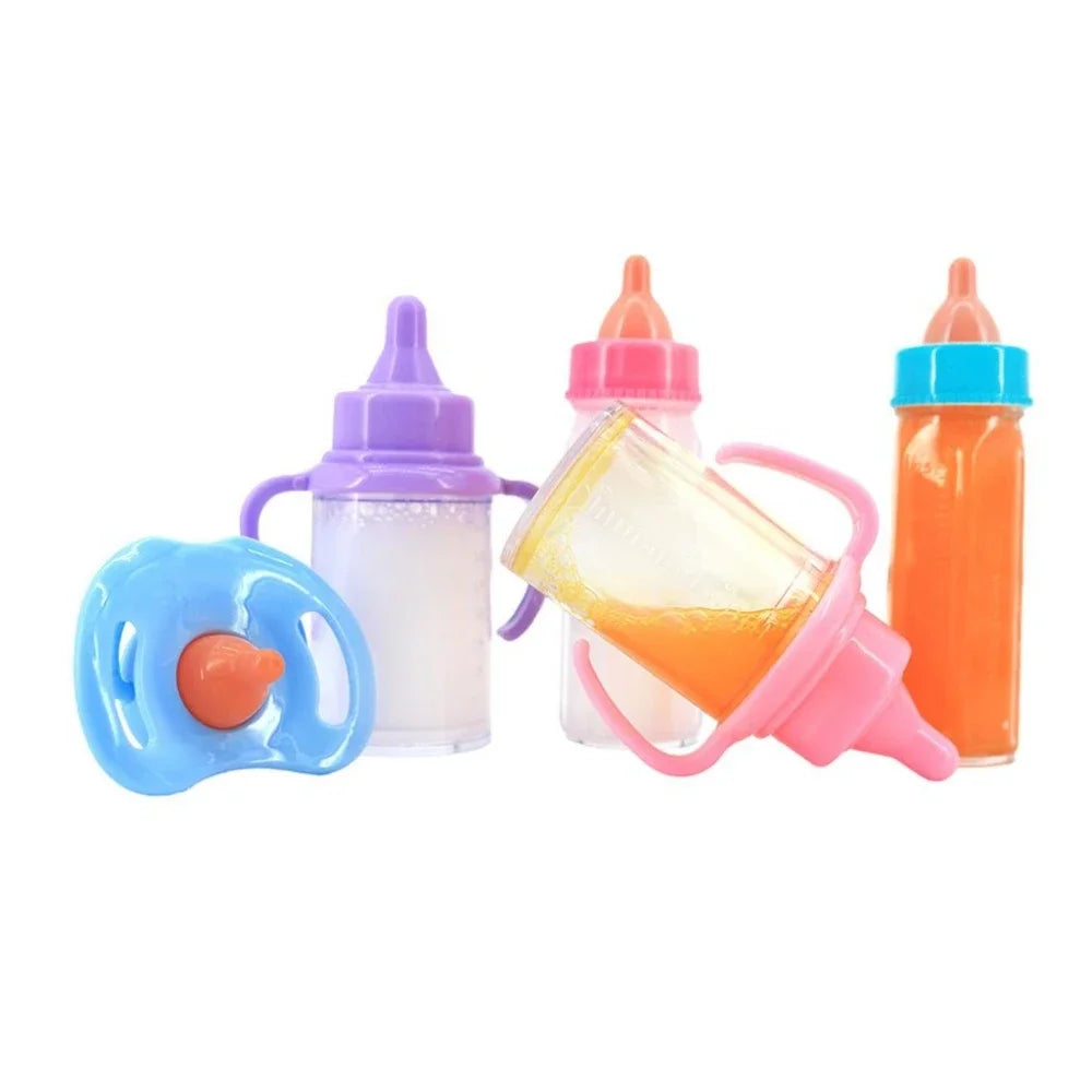 A set of large doll feeding bottles in purple, orange, and blue with a toy pacifier.