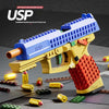 A yellow and blue building block toy gun is shown with various yellow and red ammunition pellets on a dark surface.
