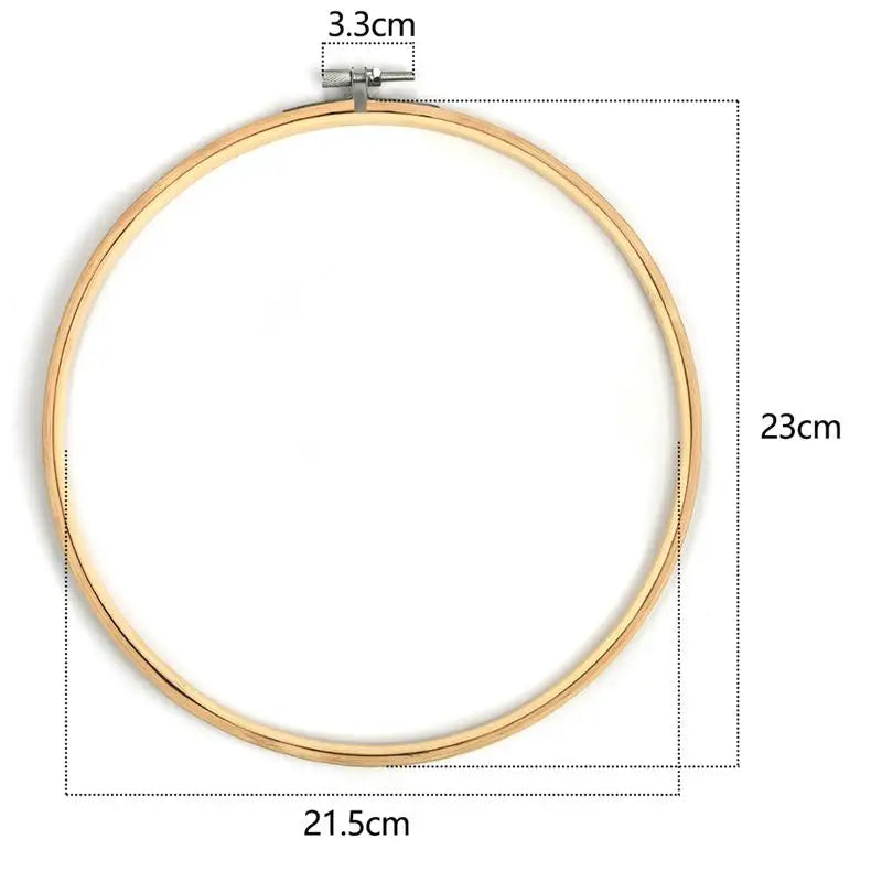A circular bamboo embroidery hoop with a 3.3cm clamp and a 23cm diameter.