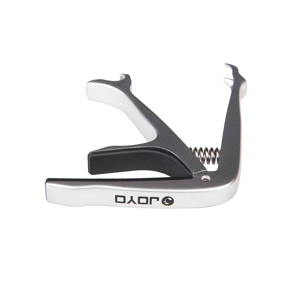 Silver and black zinc alloy guitar capo with a spring mechanism