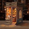 A detailed wooden miniature kit of a Magic Wand Shop display featuring glass cabinets and antique-style books.
