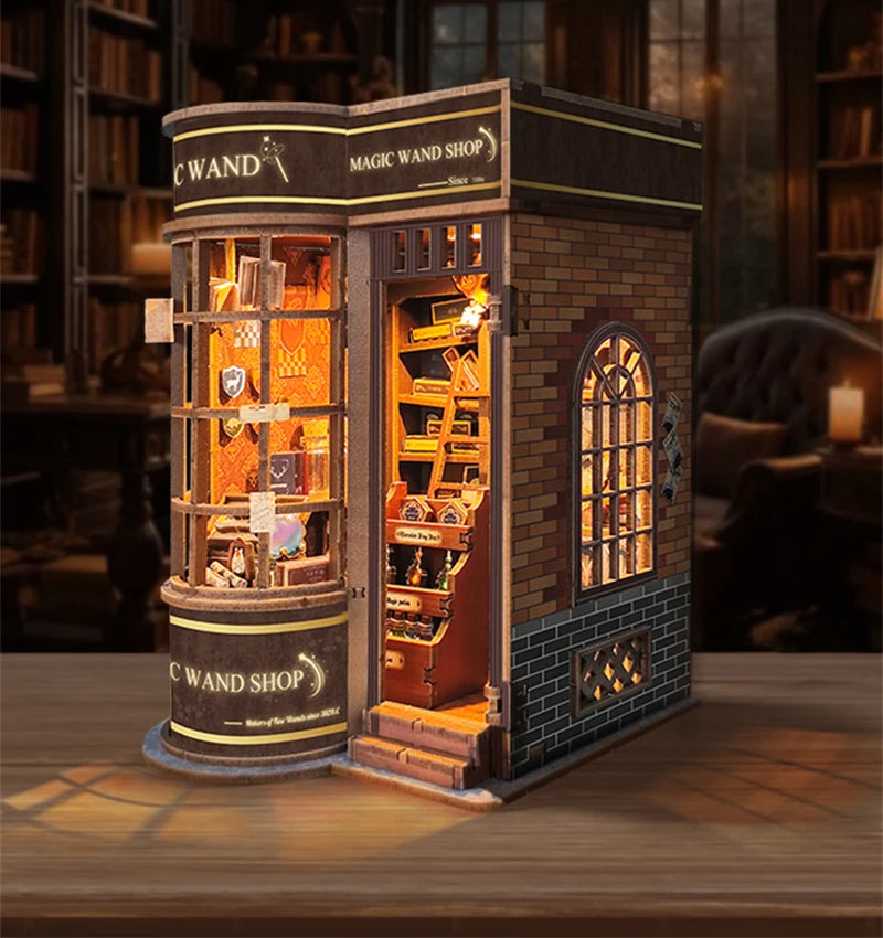 A detailed wooden miniature kit of a Magic Wand Shop display featuring glass cabinets and antique-style books.