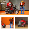 A miniature collectible of an Alloy motorcycle helmet and rider figure.