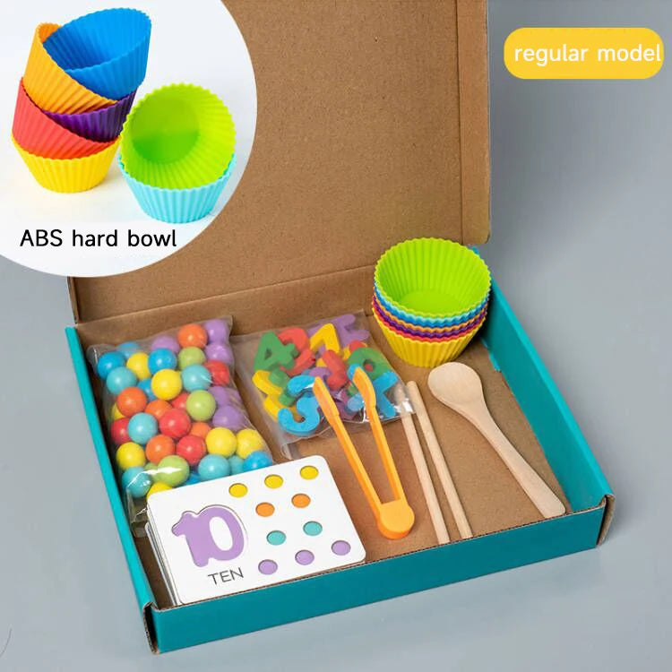 A box containing ten colorful plastic bowls and wooden tools for a Montessori clip beads sorting toy