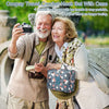 An elderly couple smiling while holding a crochet hook set with a case outdoors.