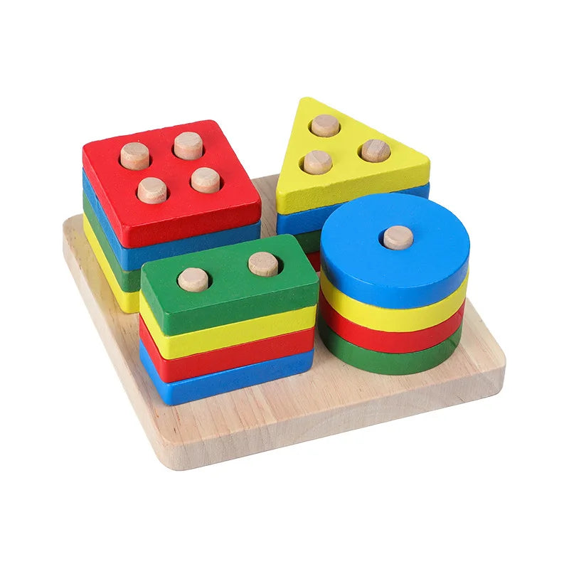 A set of wooden sensory blocks in red, yellow, green, and blue with wooden beads on top, displayed on a light wooden board.