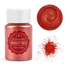 A glass jar of bright red pearl powder next to a swirling red pigment and scattered red powder.