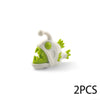 Two white plastic ocean animal building blocks with green accents.