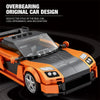 A black and orange building block model of a sports car, showcasing an original design.