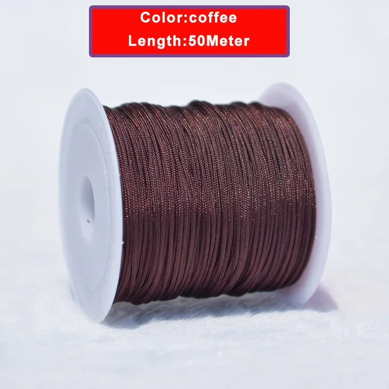 A spool of 50 meter long, 0.8mm coffee-colored nylon knotting cord for jewelry making.