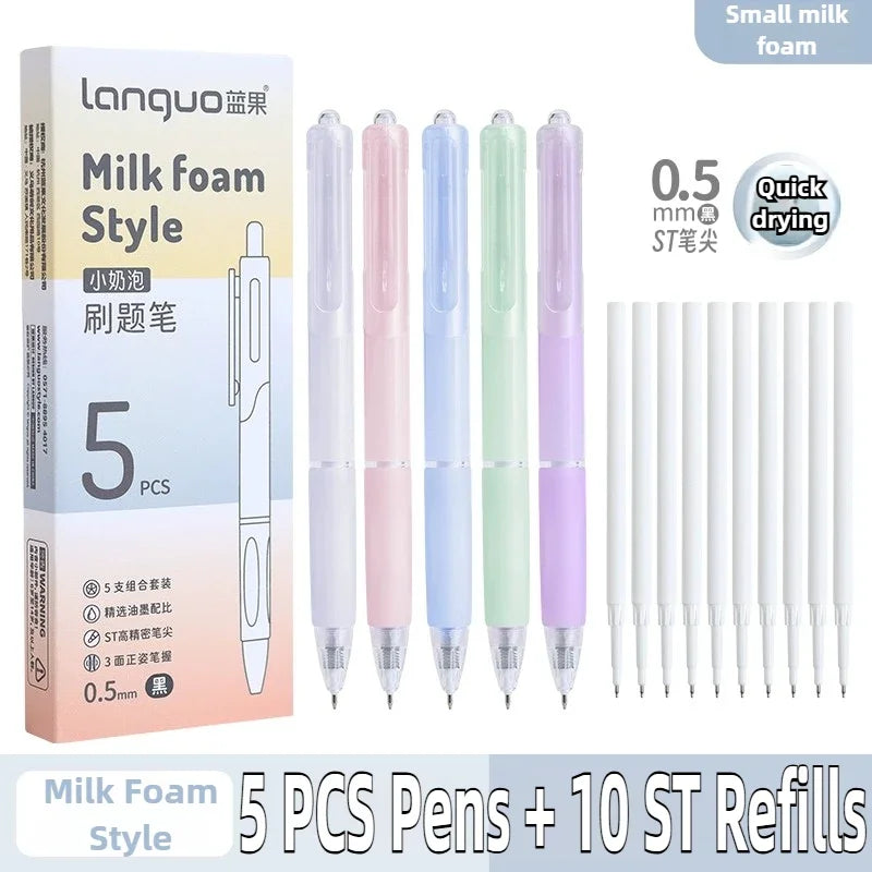 A set of five milk foam style pens in various colors with ten ST refills shown next to the packaging.