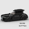 A black classic rally car building block set with a hood and wheels.