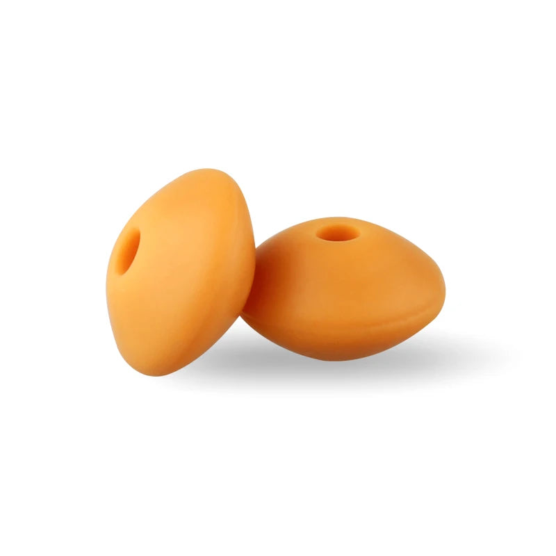 Two smooth, orange silicone lentil beads shaped like an abacus for jewelry making