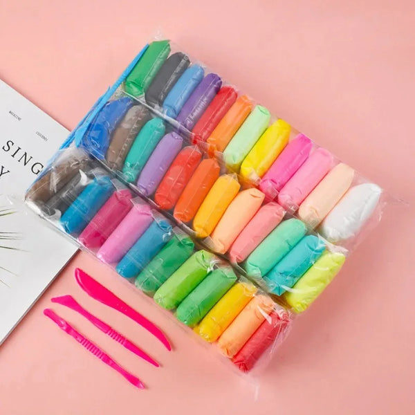 A plastic set of colorful mud for kids in various shades arranged diagonally on a pink background.