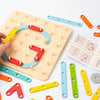 A wooden Montessori pegboard puzzle set showing various colored wooden pegs and puzzle pieces on a white surface.
