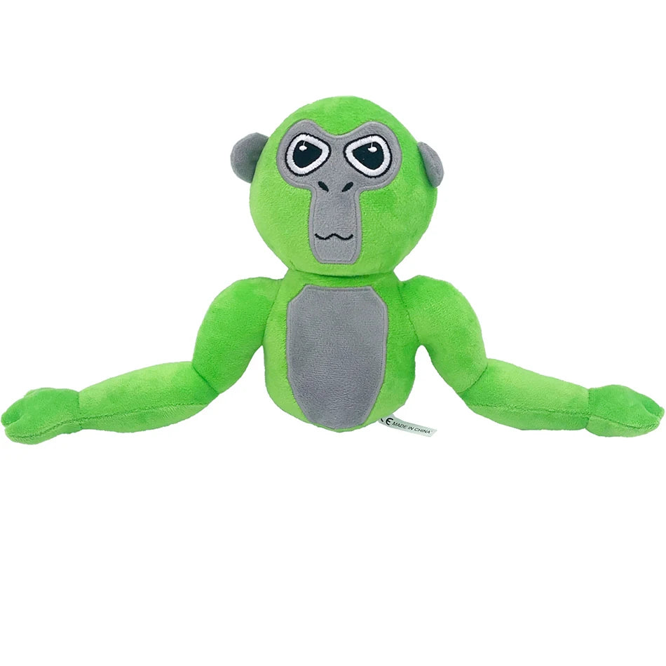 A soft green and gray plush toy of a monke gorilla with large eyes.