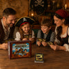 A family of four is playing a card game around a wooden table in a dimly lit room.