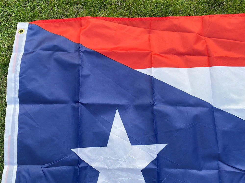 A large, folded Puerto Rico national flag banner featuring red and blue stripes and a white star on a dark blue field.