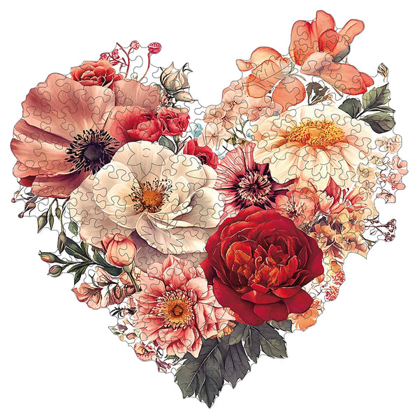 Hjärtformat pussel med färgglada torkade och färska blommor i rosa, orange, rött och vitt