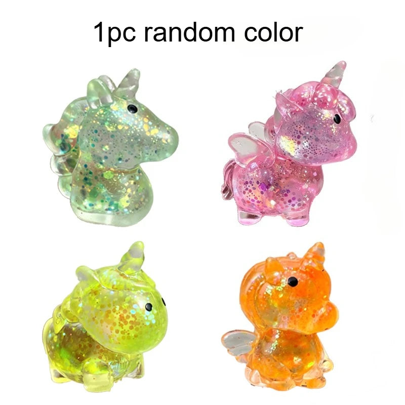 Four glitter unicorn stress balls in random colors and shades.