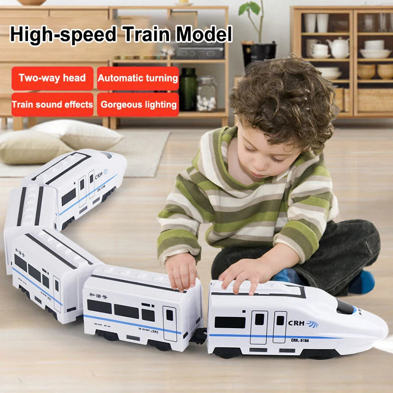 A child is playing with a white electric high-speed train model toy on a wooden floor.