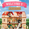 A miniature dollhouse set featuring a two-story house with furniture, animals, and nature elements.