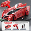 A red remote control wall climbing RC car with an infrared remote and charging cable.