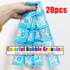 A hand holds a package of 20 colorful bubble granules for a dinosaur bubble gun.